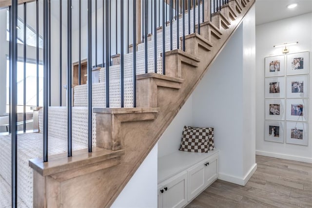 stairway with wood-type flooring