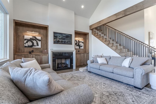 living room with high vaulted ceiling