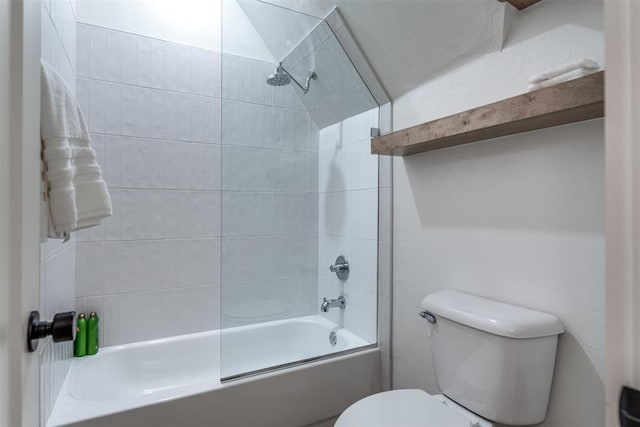 bathroom with toilet and combined bath / shower with glass door