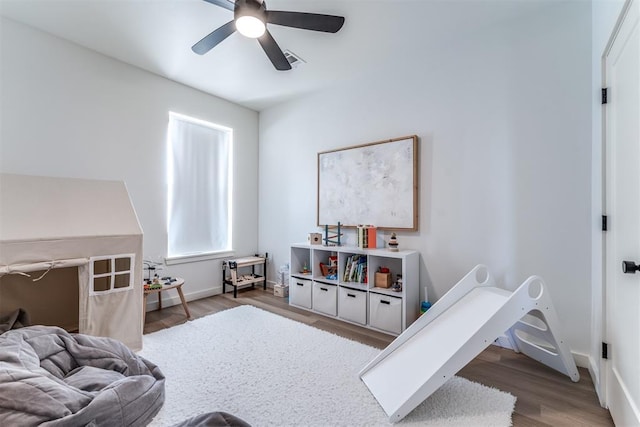 interior space with ceiling fan and dark wood-type flooring