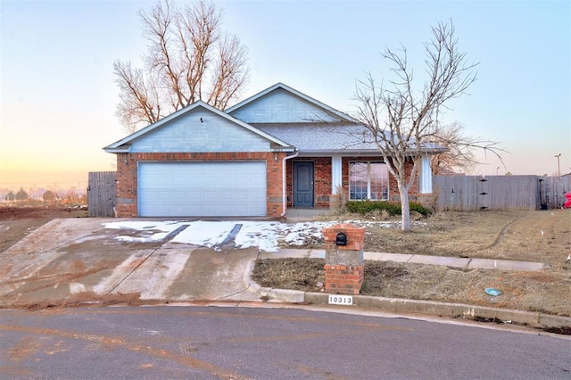 ranch-style home featuring a garage