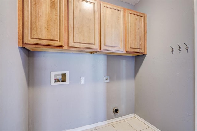 washroom with cabinets, hookup for a washing machine, electric dryer hookup, and light tile patterned floors