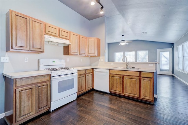 kitchen with sink, white appliances, ceiling fan, kitchen peninsula, and dark hardwood / wood-style flooring