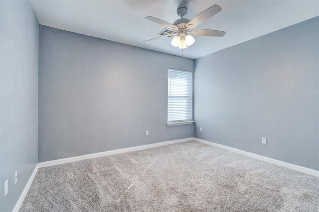 unfurnished room featuring ceiling fan and carpet flooring