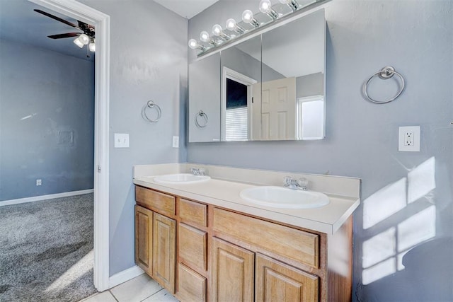 bathroom with ceiling fan, tile patterned floors, and vanity