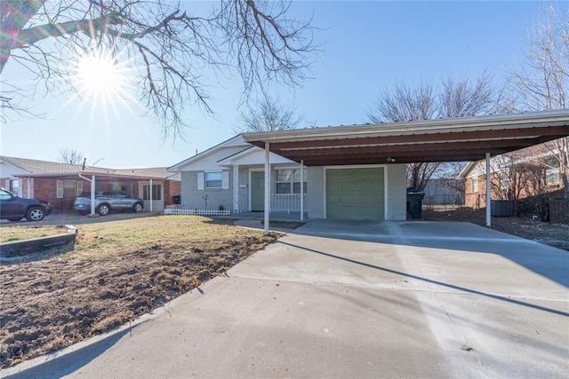 view of front facade featuring a carport and a garage