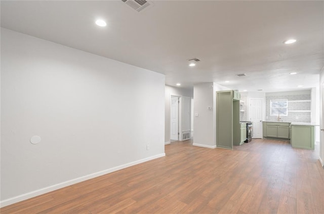 unfurnished living room featuring light hardwood / wood-style floors