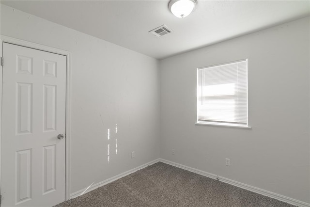 unfurnished room featuring carpet