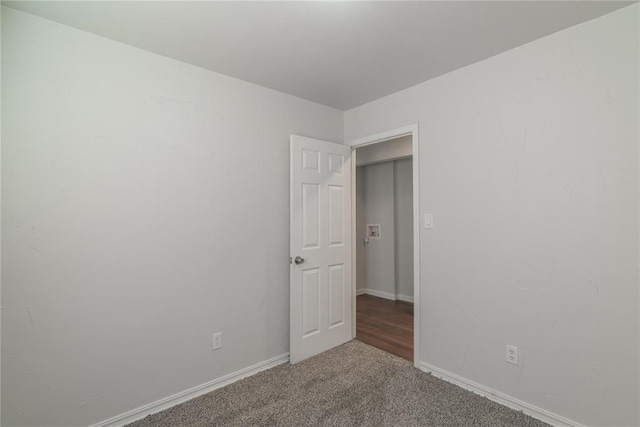 empty room featuring carpet flooring