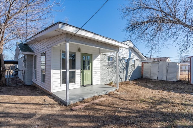 view of side of property with a storage shed