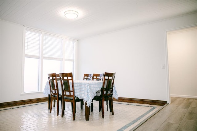 dining area featuring ornamental molding