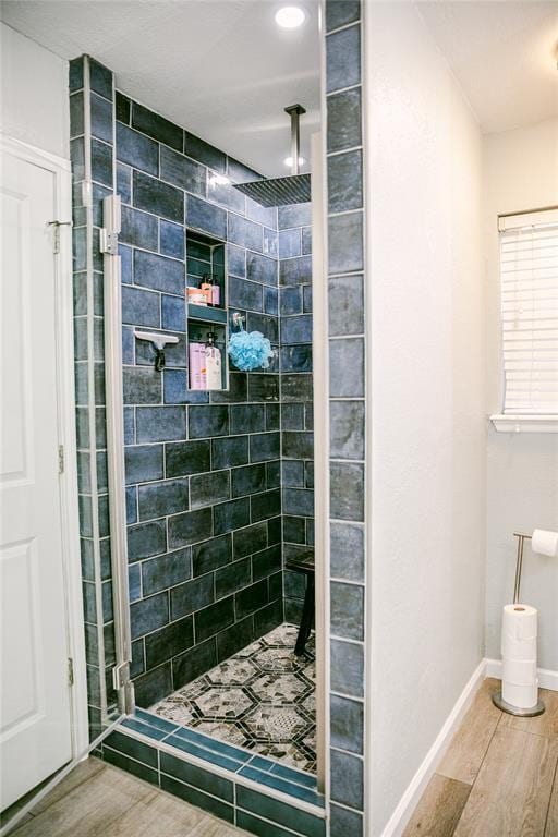 bathroom featuring a tile shower