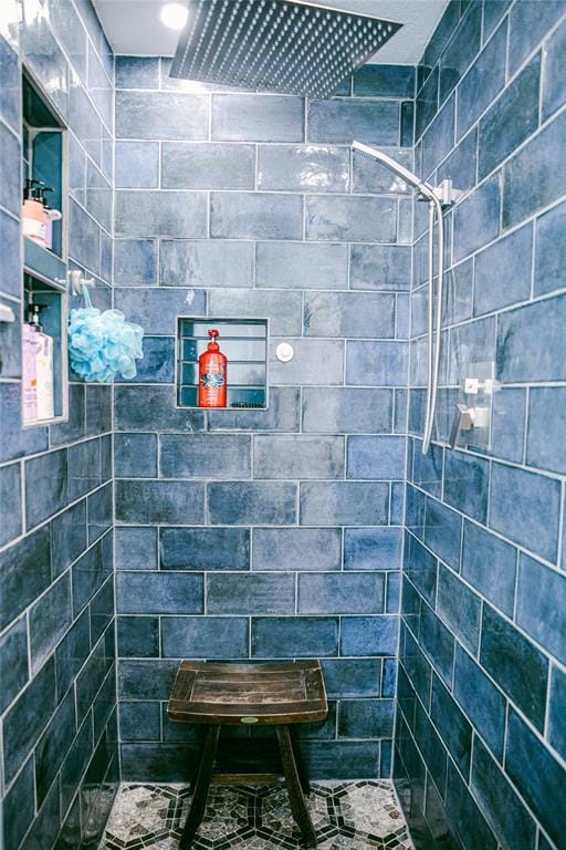 bathroom with a tile shower