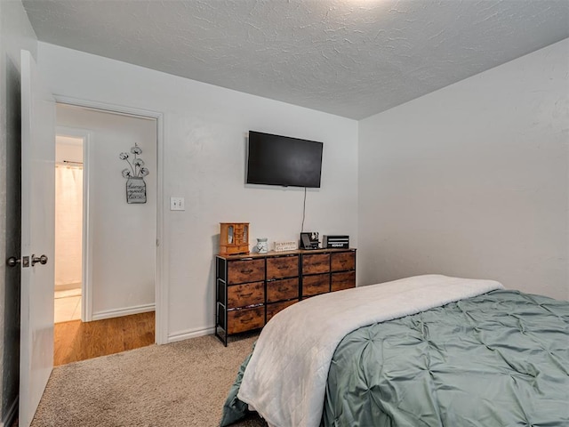 carpeted bedroom with a textured ceiling