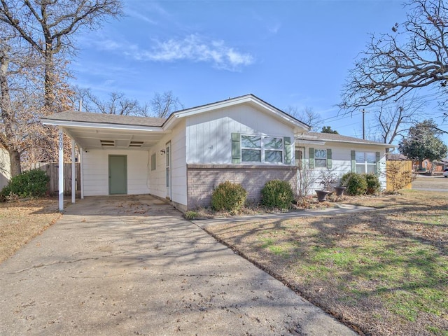 ranch-style home with a carport