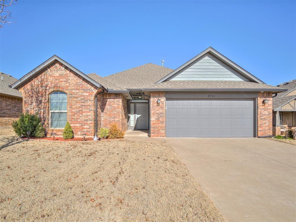 ranch-style home with a garage