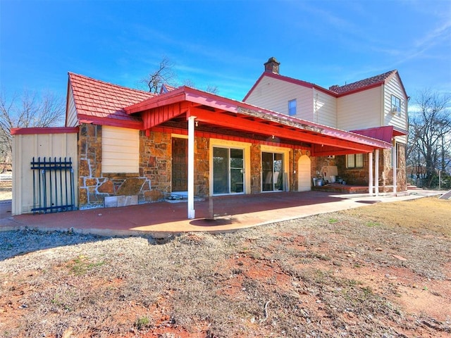 rear view of house featuring a patio area