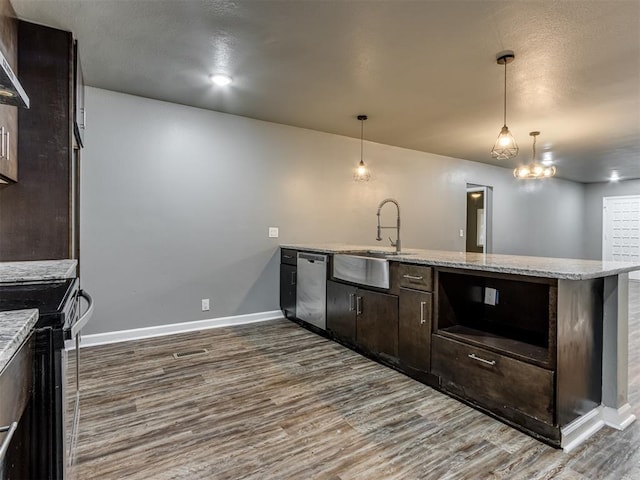 kitchen featuring sink, dark wood-type flooring, hanging light fixtures, dark brown cabinets, and appliances with stainless steel finishes