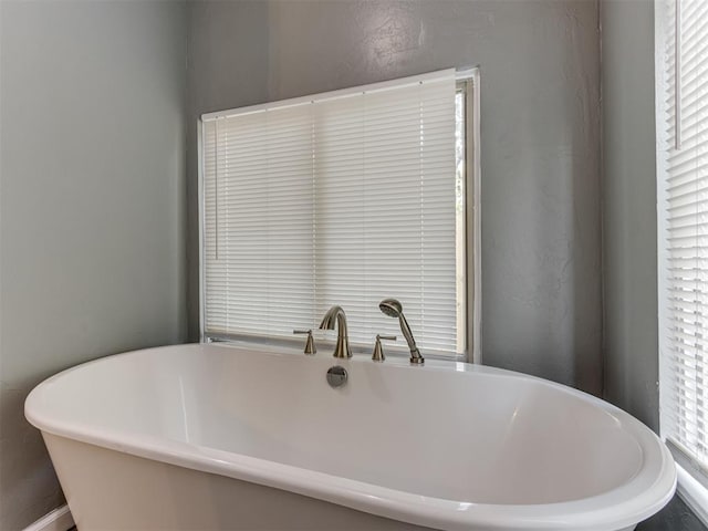 bathroom featuring a tub to relax in