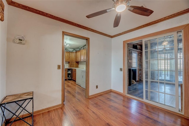 spare room with ceiling fan, light hardwood / wood-style floors, and ornamental molding