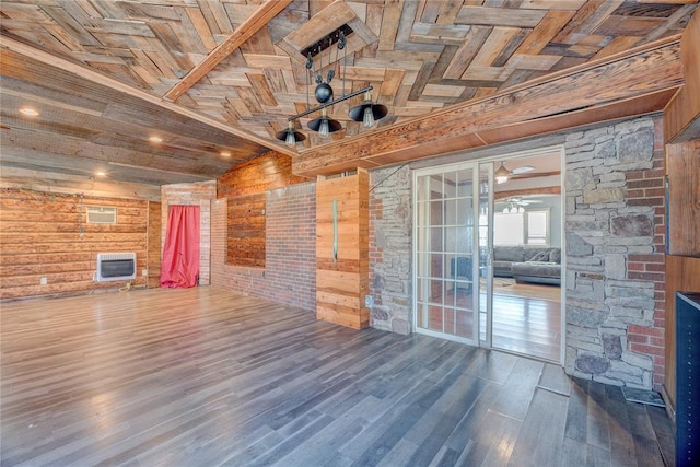 unfurnished living room with vaulted ceiling with beams, heating unit, hardwood / wood-style floors, wooden walls, and wood ceiling