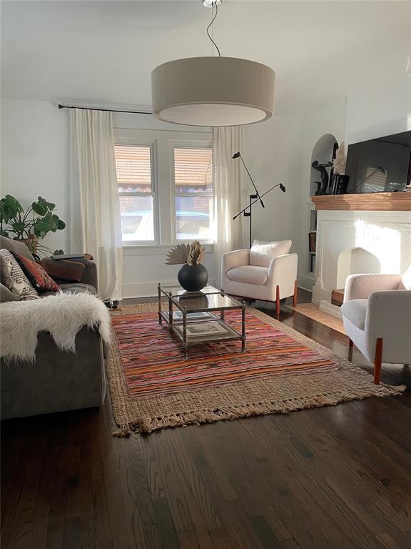 living room featuring a fireplace and hardwood / wood-style flooring