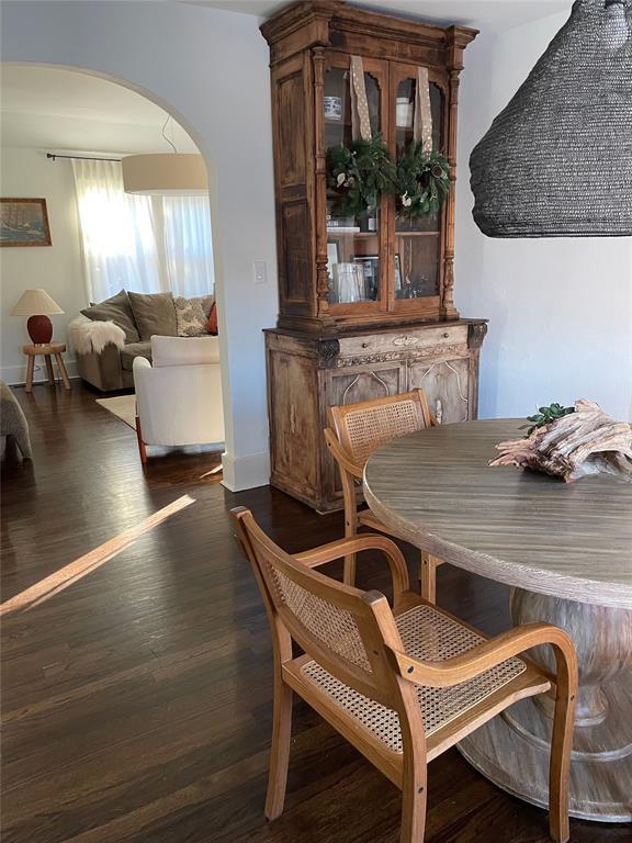 dining space with dark hardwood / wood-style floors