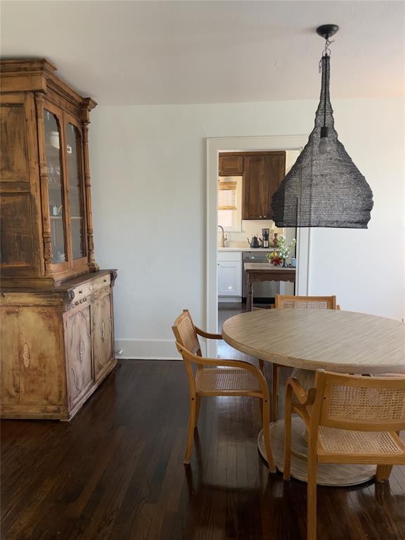 dining area featuring dark hardwood / wood-style flooring and sink