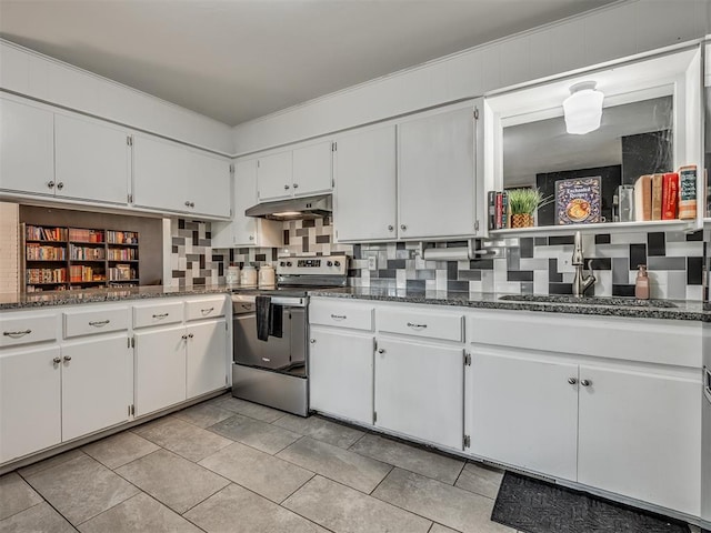 kitchen featuring stainless steel electric stove, backsplash, white cabinetry, and dark stone counters