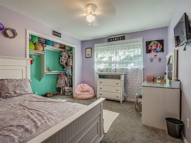 bedroom with ceiling fan, light carpet, and a closet