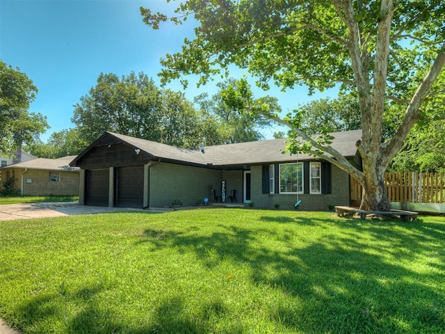 ranch-style house with a front yard and a garage