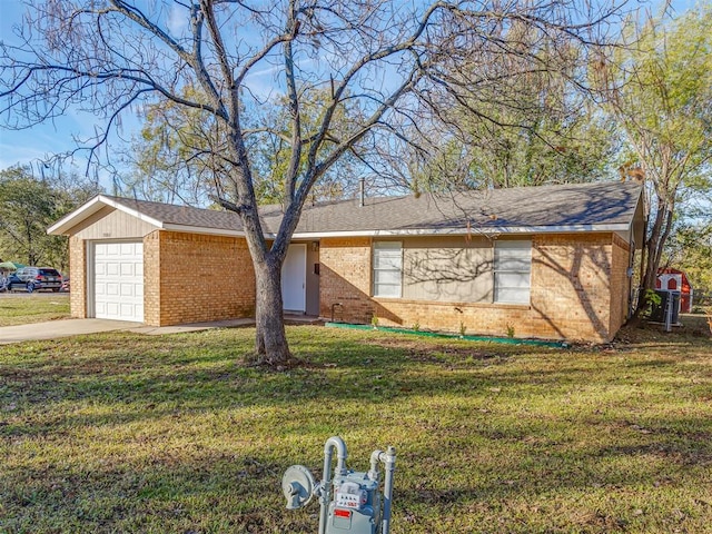 single story home with a garage and a front lawn