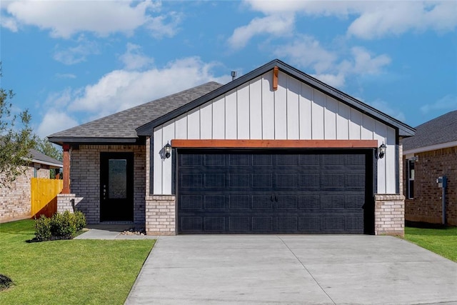 view of front facade with a front lawn and a garage