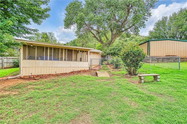 view of yard with a sunroom