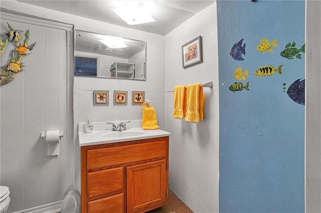 bathroom featuring vanity and toilet