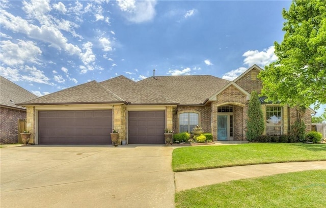 view of front of house with a front lawn and a garage