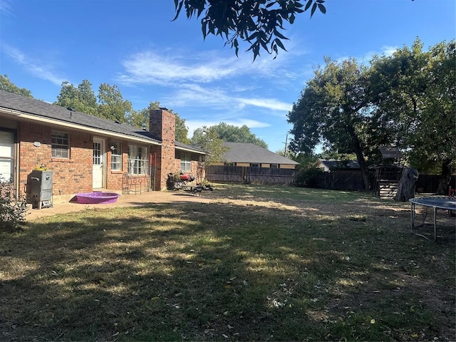 view of yard featuring a trampoline