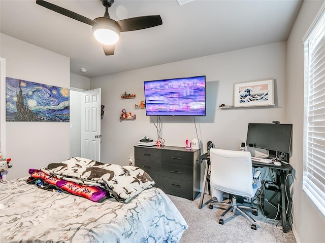 bedroom featuring light colored carpet and ceiling fan