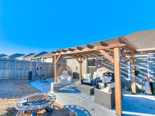 view of patio / terrace featuring a pergola and an outdoor living space with a fire pit