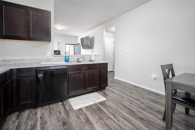 kitchen with dishwasher, wood-type flooring, dark brown cabinets, and sink