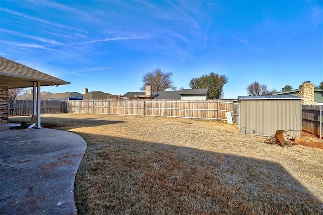 view of yard with a patio area and a shed