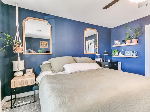 carpeted bedroom with ceiling fan