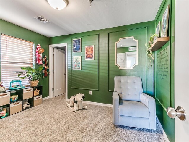 living area featuring carpet flooring