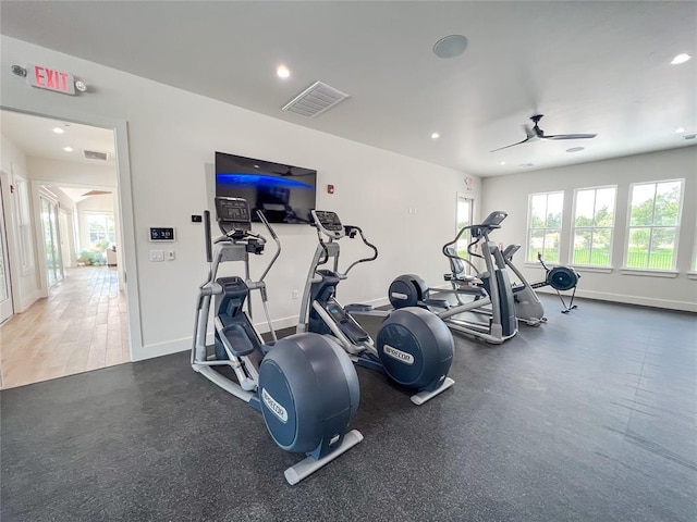 exercise room featuring a ceiling fan, recessed lighting, visible vents, and baseboards