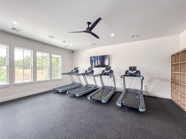 workout area featuring baseboards, visible vents, and recessed lighting