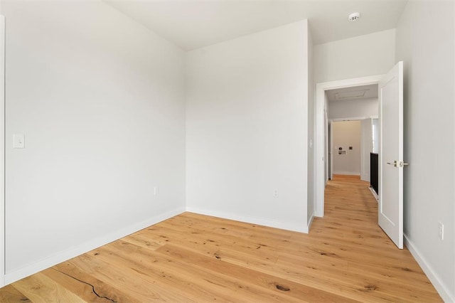 spare room featuring hardwood / wood-style flooring