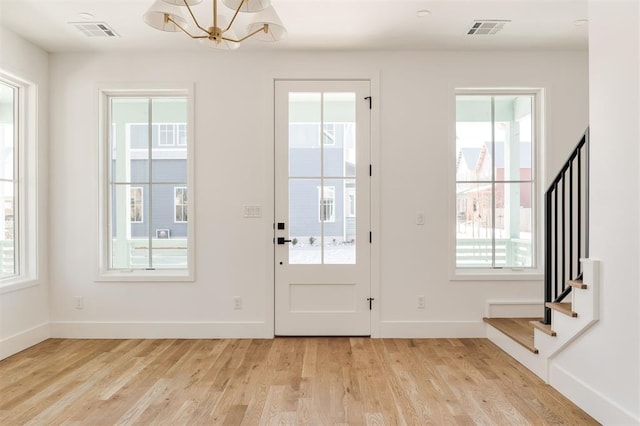 doorway featuring a healthy amount of sunlight and visible vents