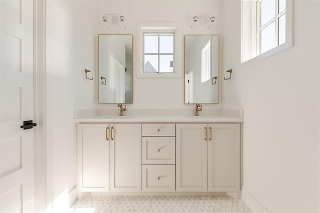 bathroom featuring double vanity and a sink