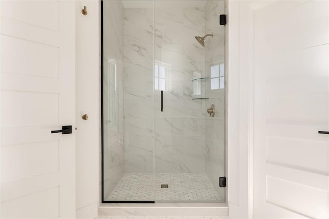 full bath with a marble finish shower