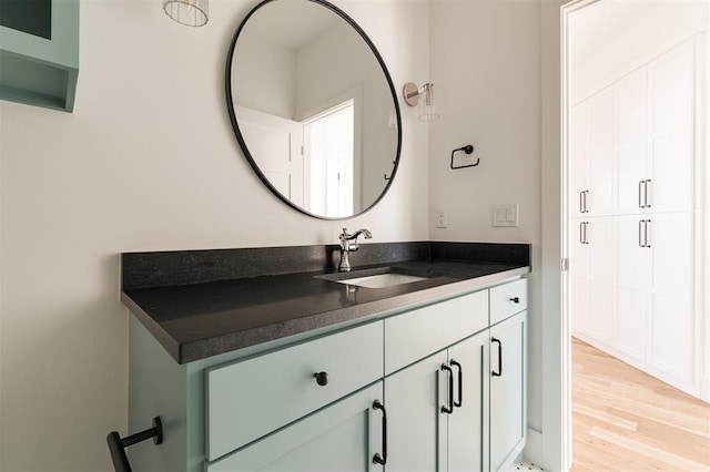 bathroom featuring wood finished floors and vanity